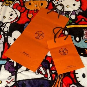 2 Hermès Orange Shopping Bags